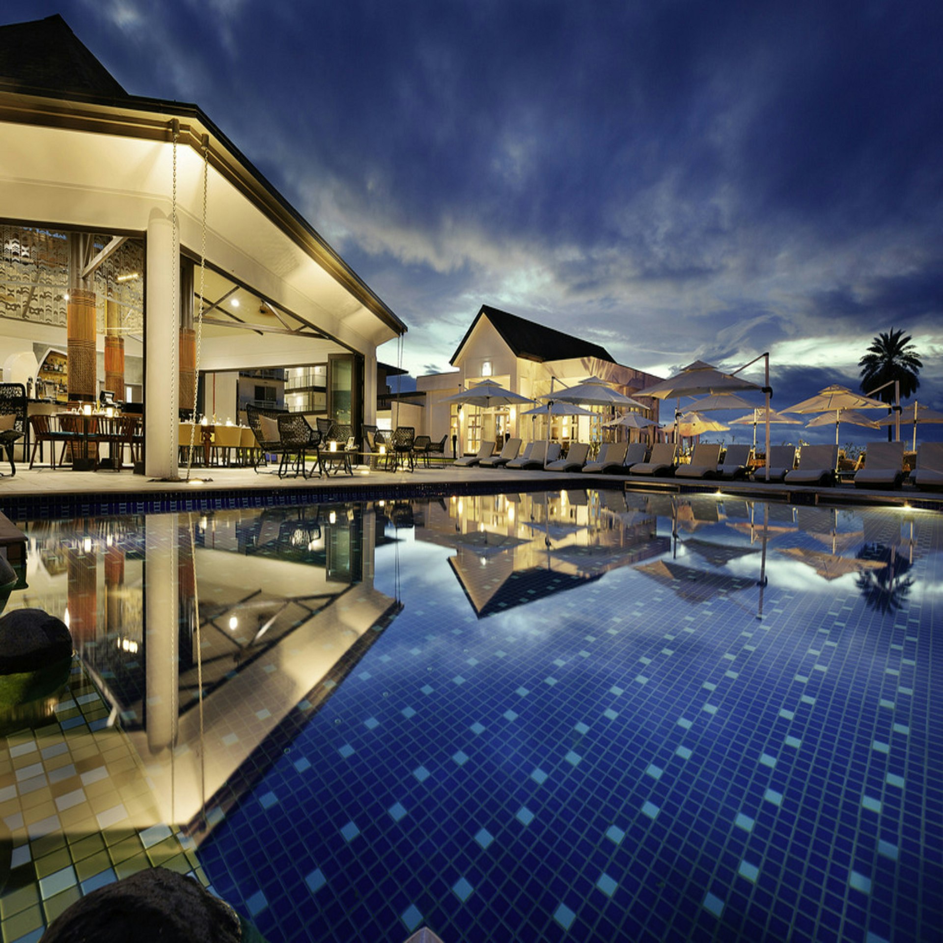 Serene infinity rooftop pool with panoramic skyline views
